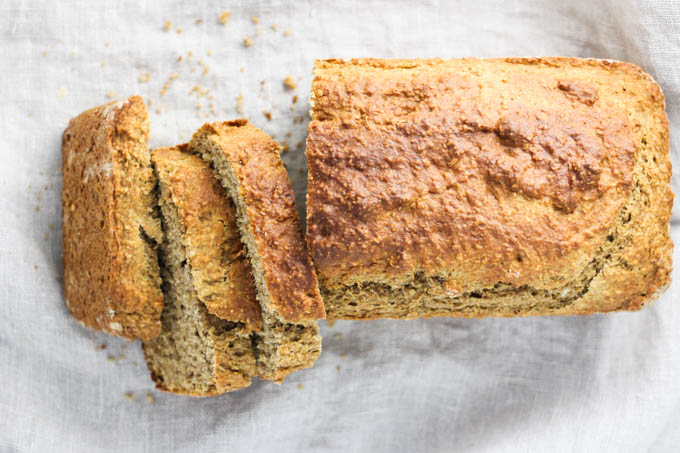 A top view of the banana bread with three slices cut off.