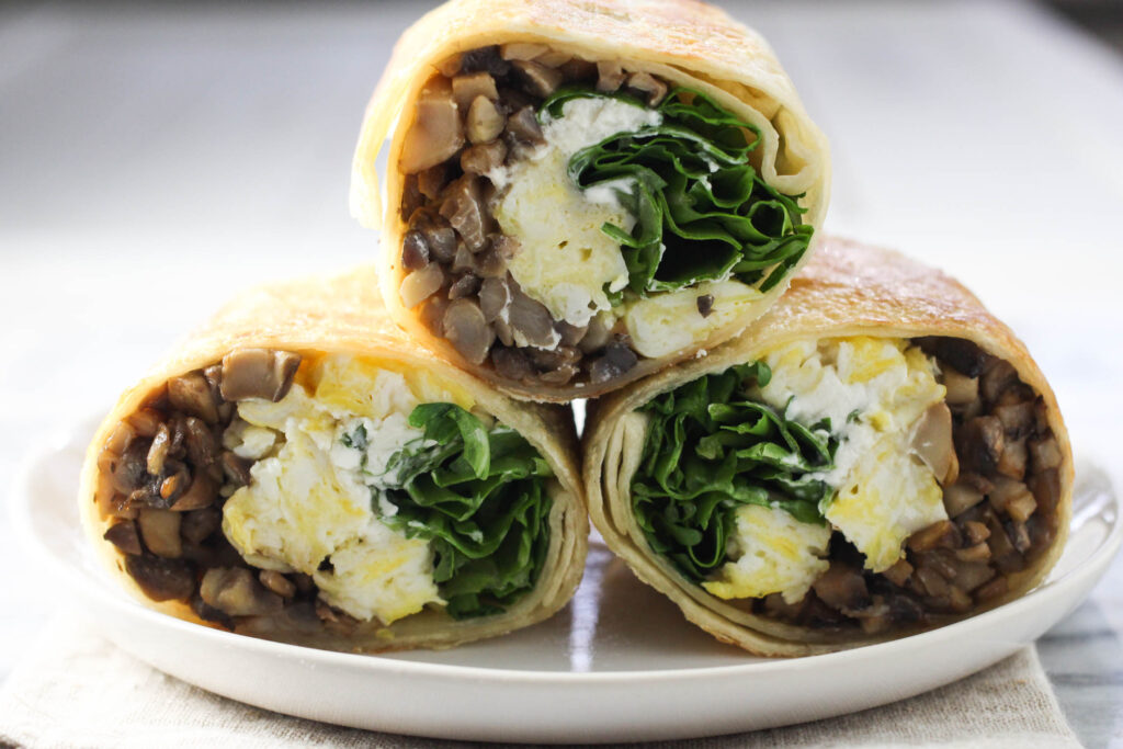 Three mushroom wrap slices on a plate.
