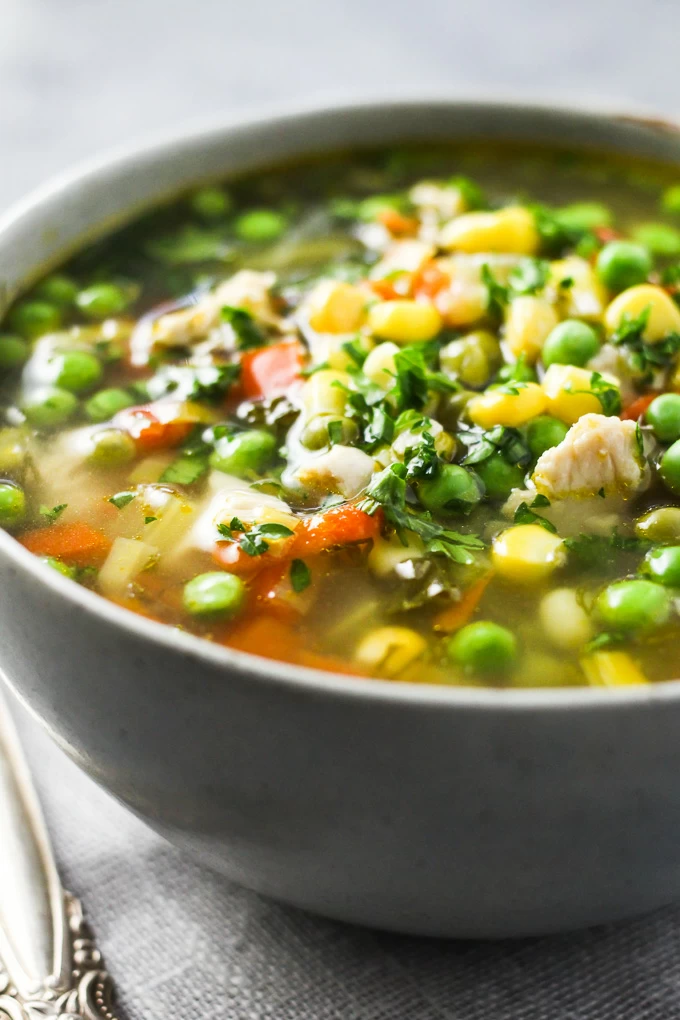 Chicken vegetable soup in a bowl.