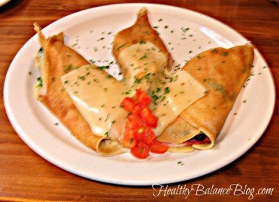Stuffed crepes on a plate.