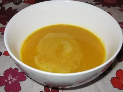 Vegan sweet potato soup in a white bowl.