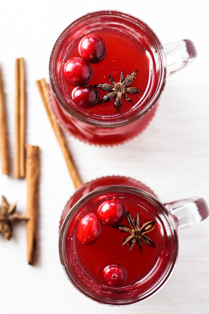 Overheadshot of two glasses with Christmas cranberry punch.