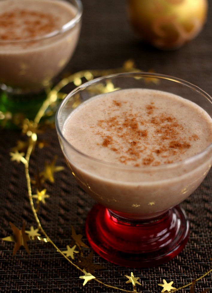 Vegan eggnog in a dessert glass.