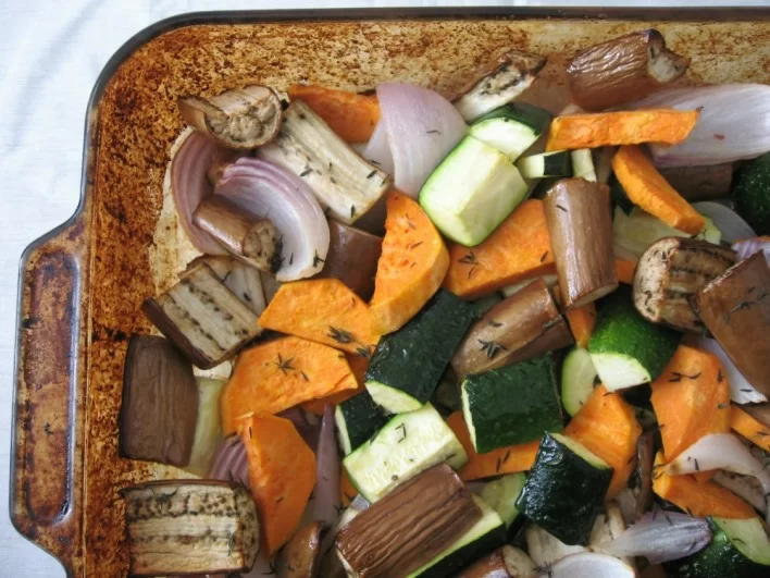 Roasted veggies in a backing dish.