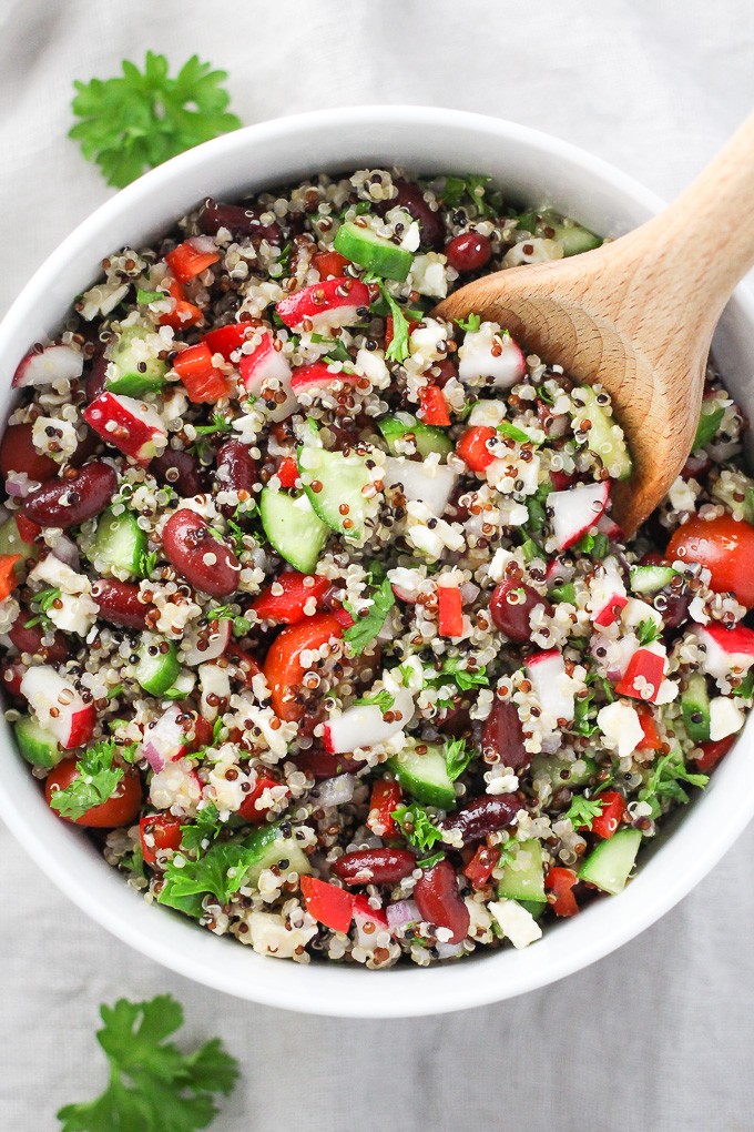 Overhead shot of the Mediterranean quinoa salad with red beans and feta in a salad bowl.