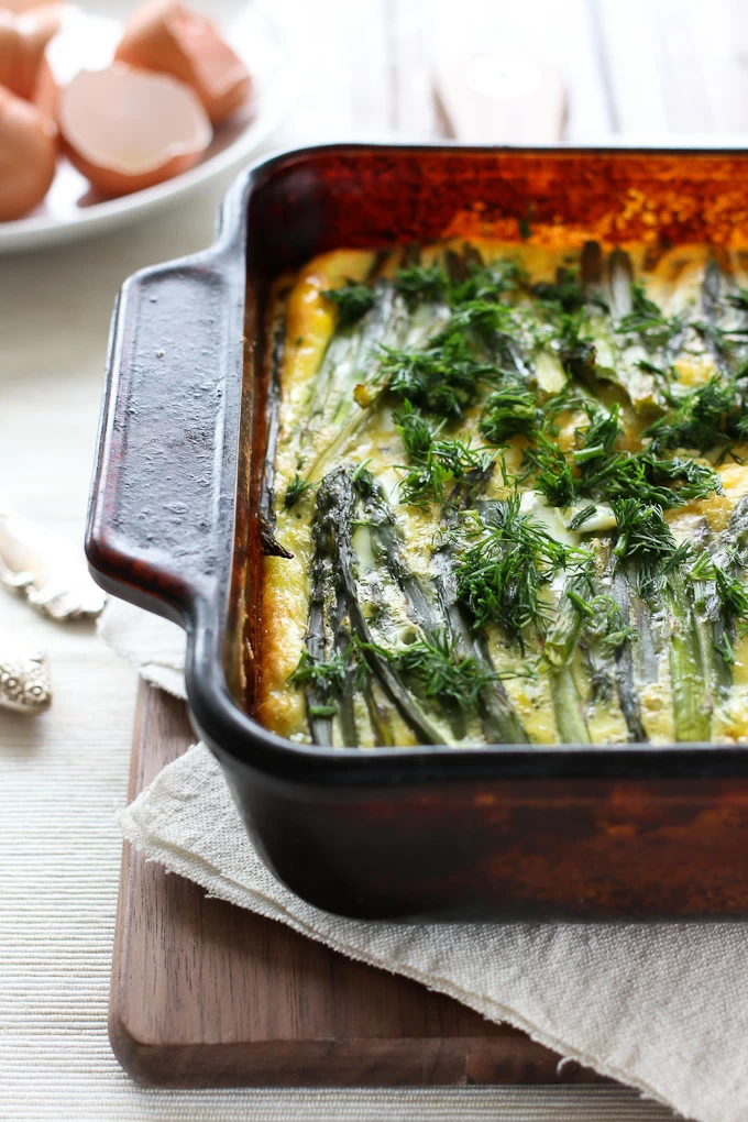 Asparagus and salmon egg bake in a baking dish.