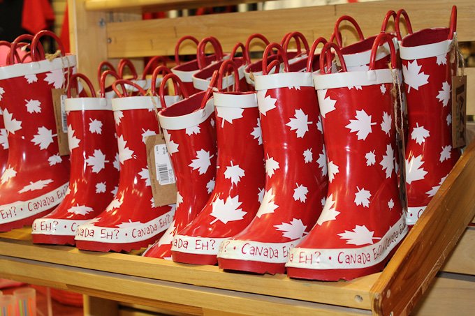 Red and white rain boots with the Canadian maple leaf.