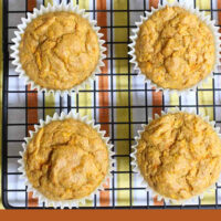 Overhead shot of the carrot muffins on a cooling rack. Below the image, there is a text overlay saying: savory carrot muffins recipe.