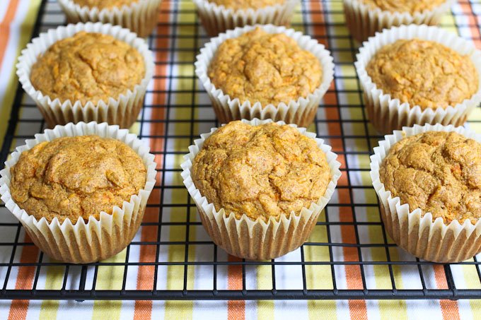 Close up shot of carrot muffins on a cooling rack.