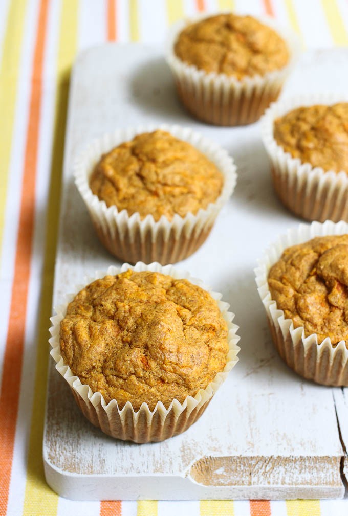 Savory carrot muffins on a cutting board.