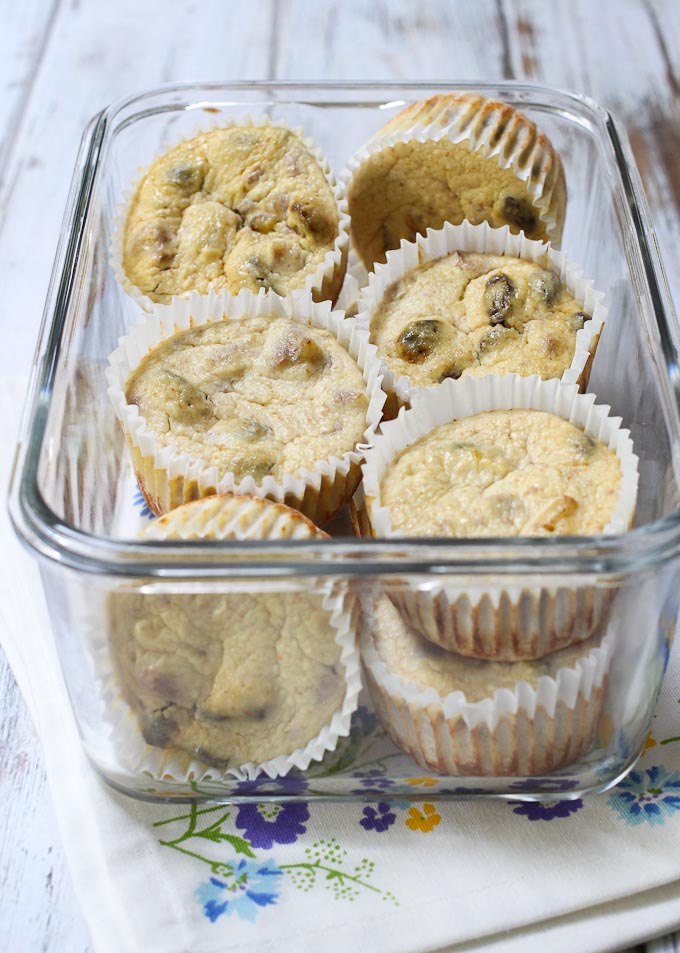 Cheesecake cupcakes in a glass container.