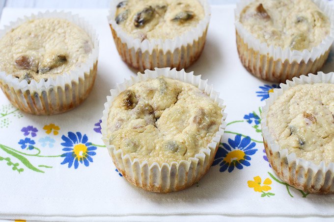 Cheesecake cupcakes on a tea towel.