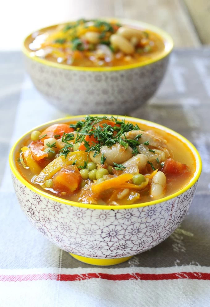 Chicken and white bean soup in bowls.