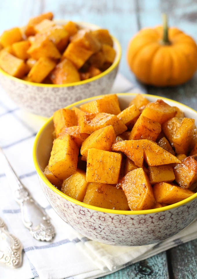 Roasted butternut squash cubes in a bowl.