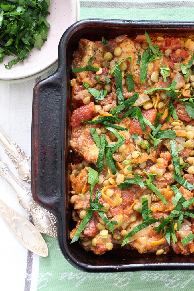 Chicken and green lentil in a baking dish. Top view.