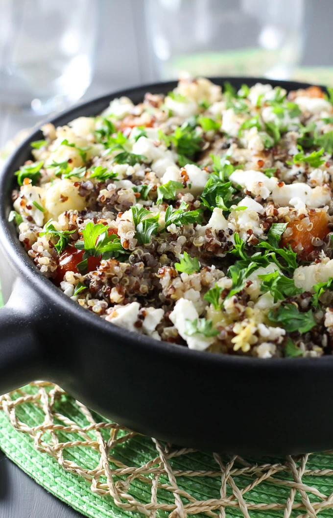 Vegetarian quinoa bake in a black pan.