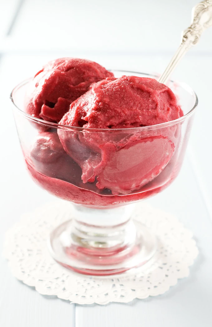 Raspberry ice cream in a glass.
