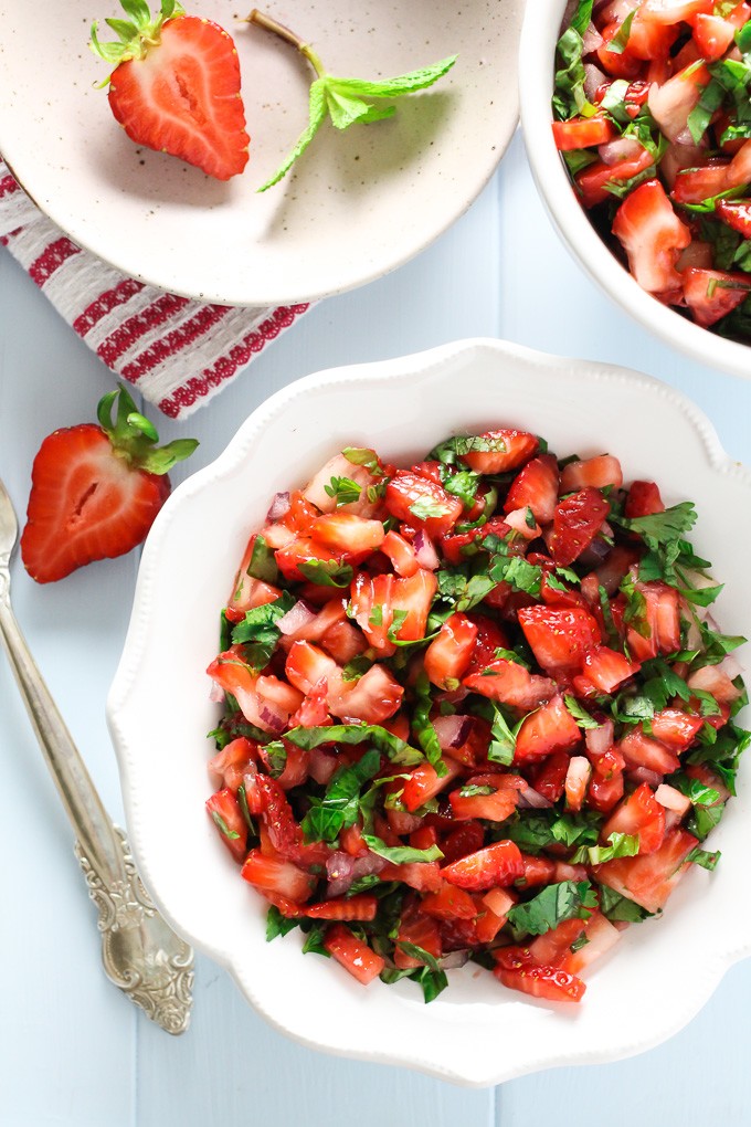 Strawberry salsa on a white plate. Top view.