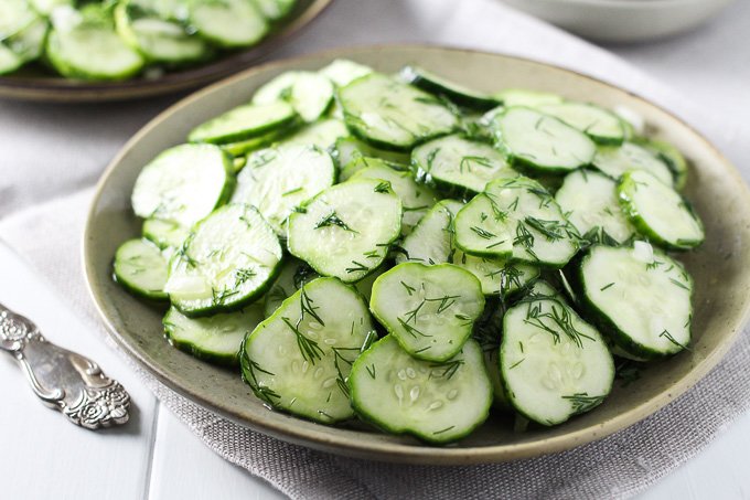 German cucumber salad on a plate.