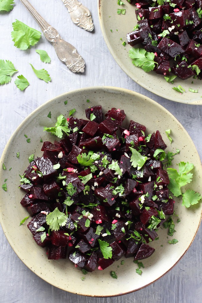 Top view of the Mediterranean Beets with Garlic and Olive Oil on a plate standing on grey background.