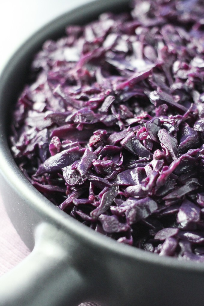 Close-up side view of the German Red Cabbage in a black pan.