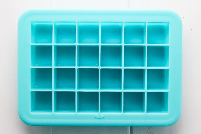 Blue silicon ice cube tray with 24 small cubes.