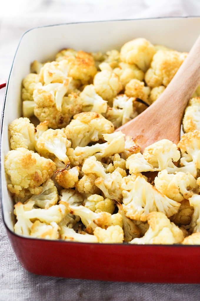 Oven roasted cauliflower in a backing dish.