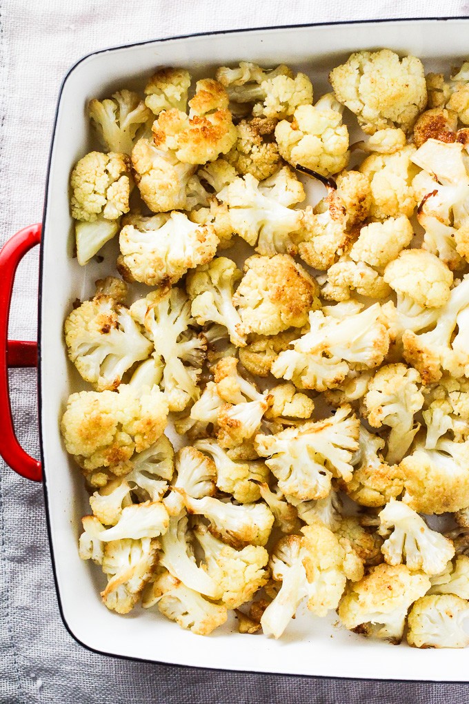 Oven roasted cauliflower in a backing dish. Top view.