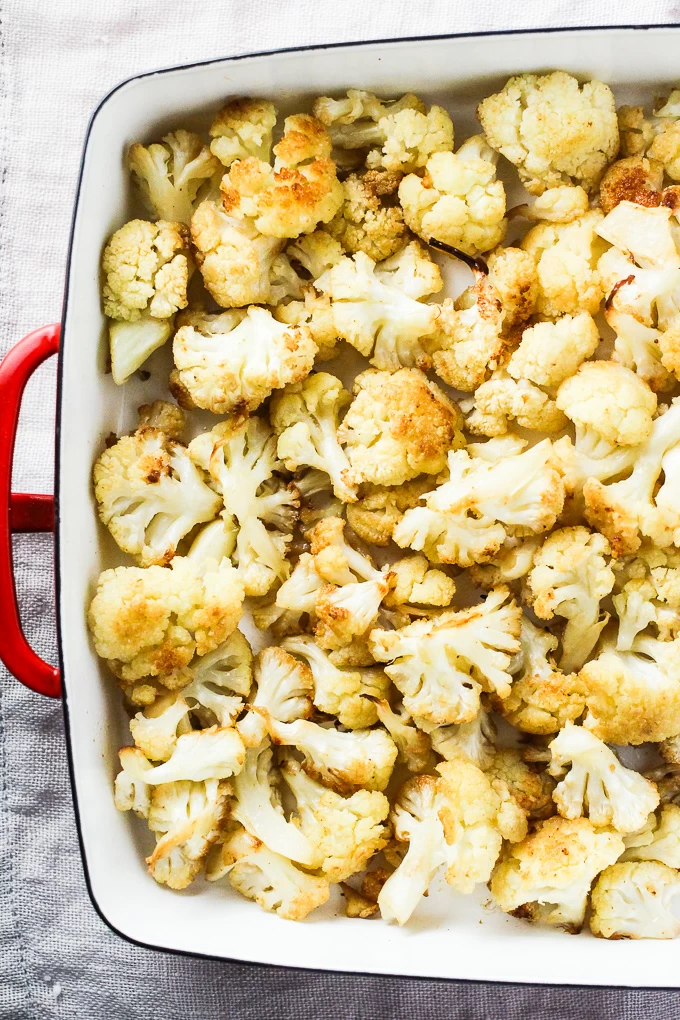 Oven roasted cauliflower in a backing dish. Top view.