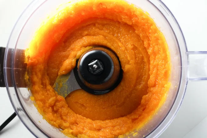 Top view of a butternut squash puree in a blender.