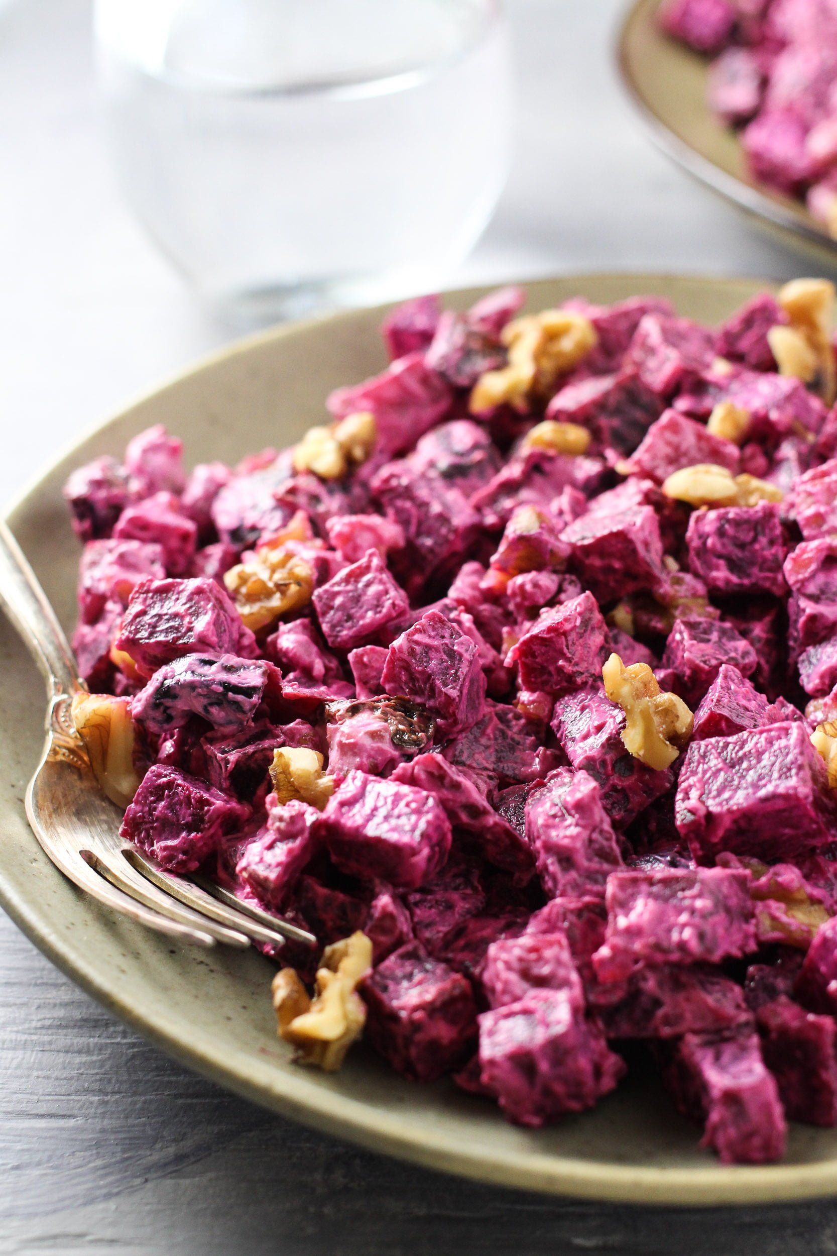 Beet salad with walnuts on a plate.