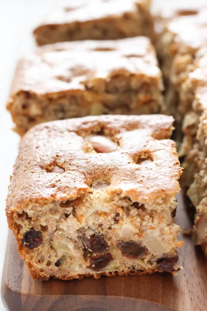 Close up shot of a slice of the healthy apple cake.