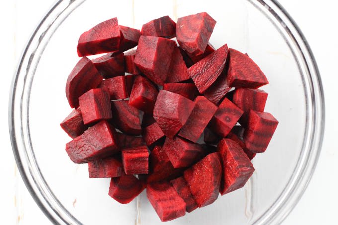Sliced beets in a glass bowl.