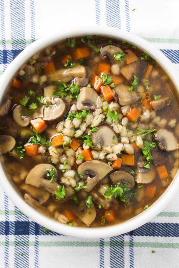 Instant Pot barley mushroom soup in a bowl shot from above.