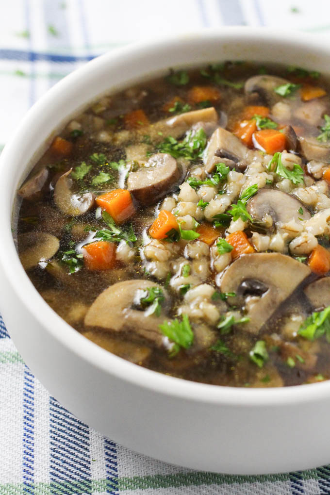 Instant pot mushroom barley soup in a white bowl.