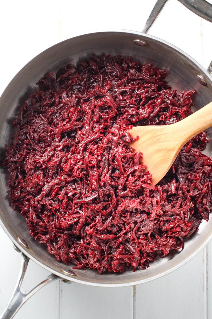 Sauteed beets in a pan.