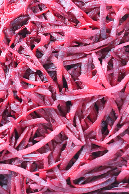 Close up shot of raw grated beets.