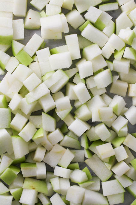 Close up shot of diced green apple.