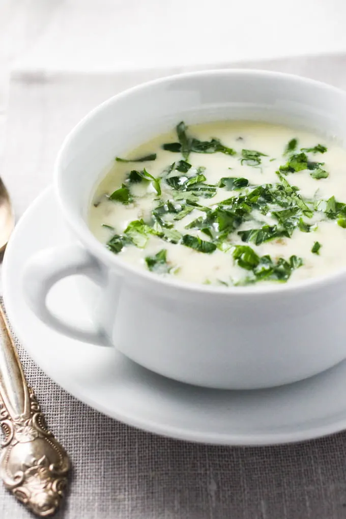 Armenian yogurt soup Spas in a white bowl. Garnished with parsley.