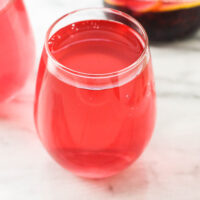 A glass with blueberry water.