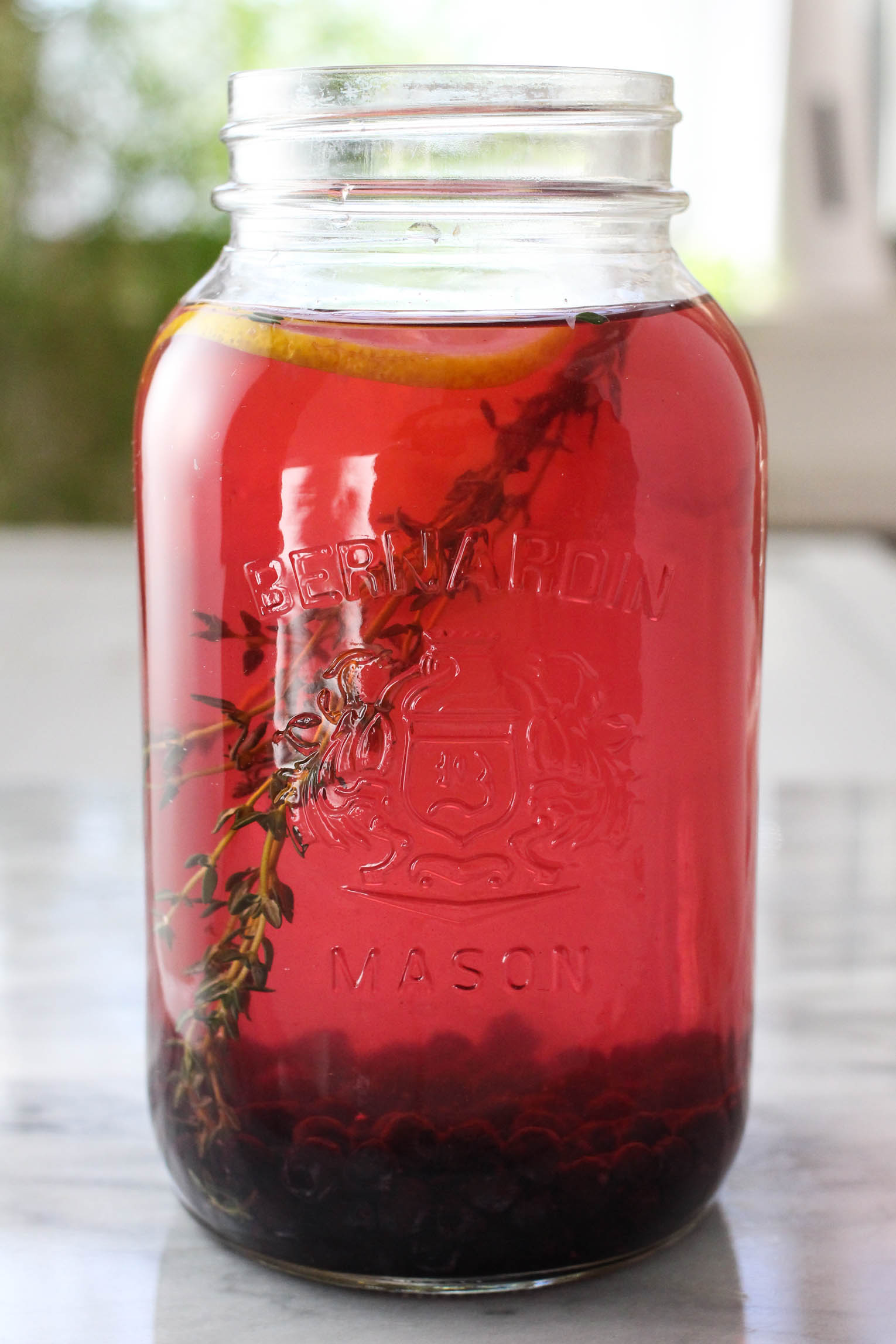 Blueberry water in a Mason jar.