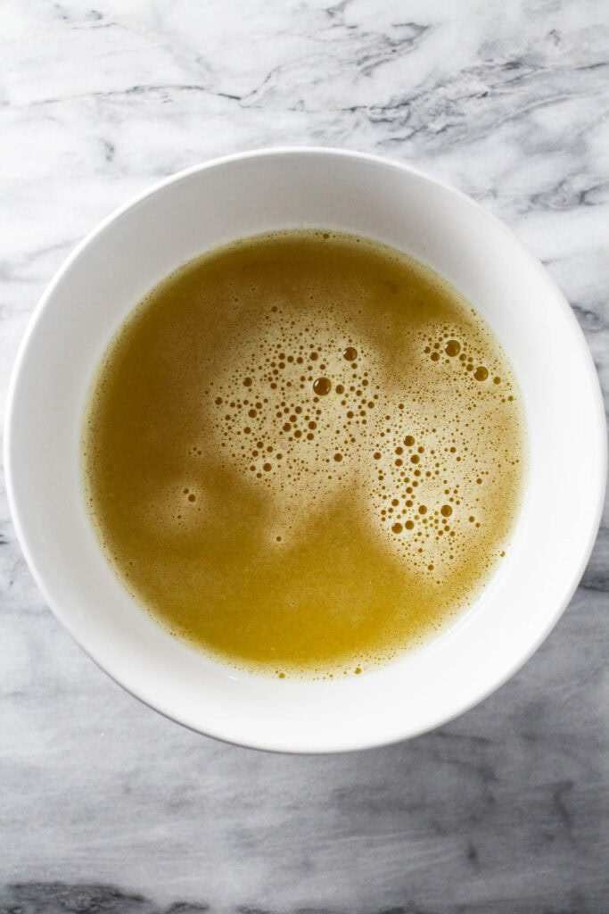 Strained pineapple juice in a bowl.