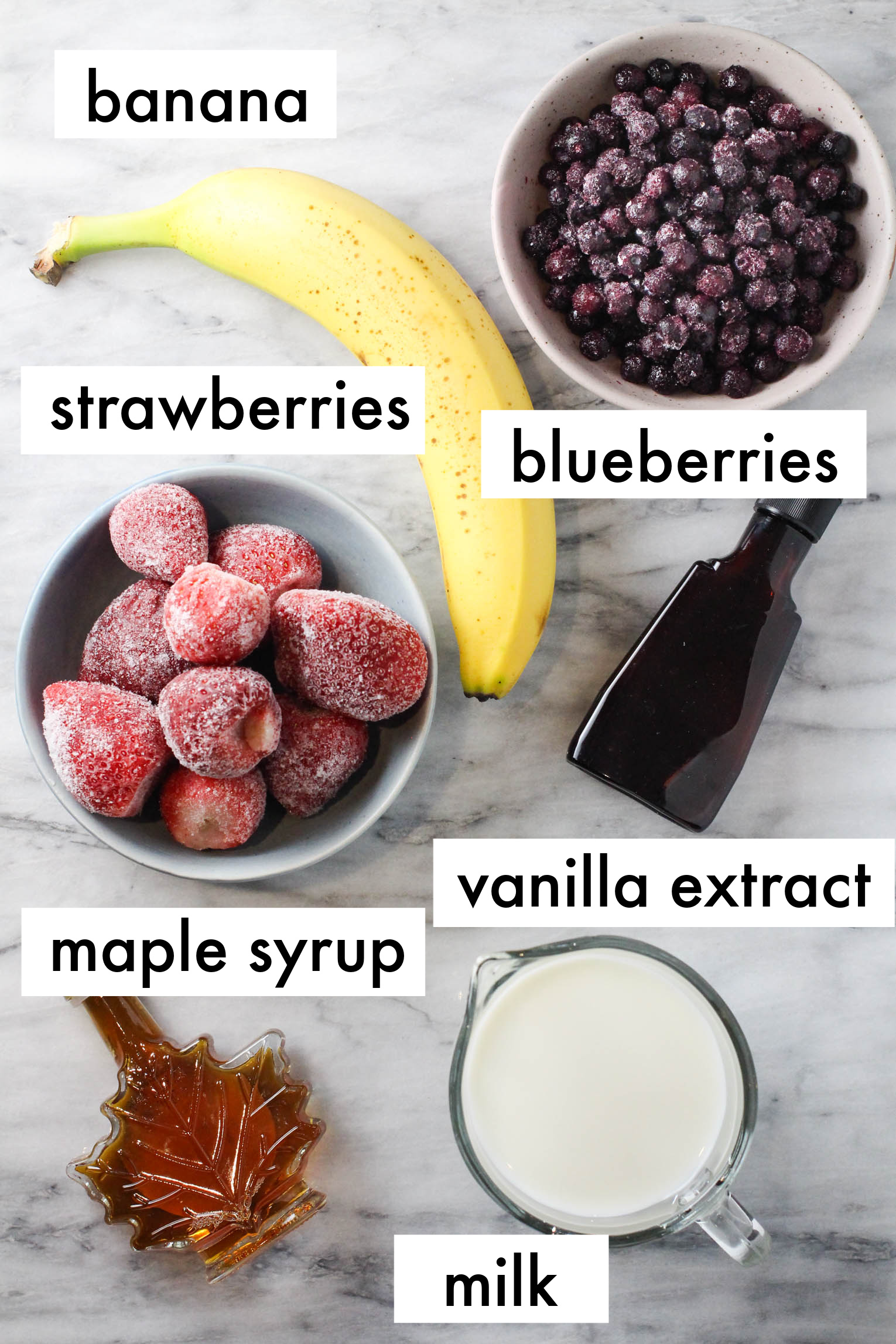 Smoothie ingredients labled as follows: banana, strawberries, blueberries, maple syrup, vanilla extract, milk.
