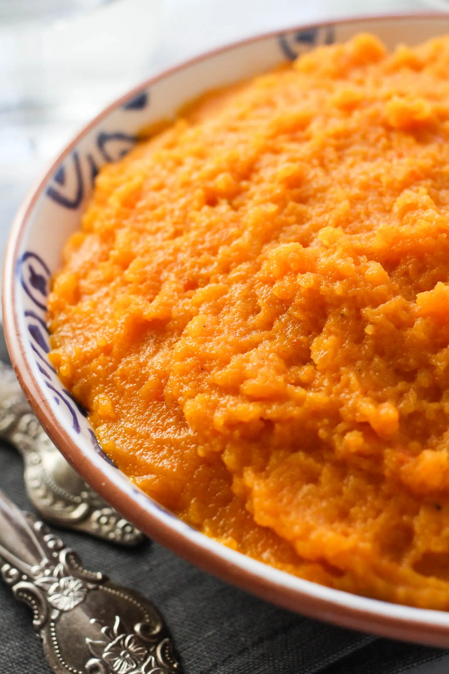 Carrot and swede mash in a bowl.