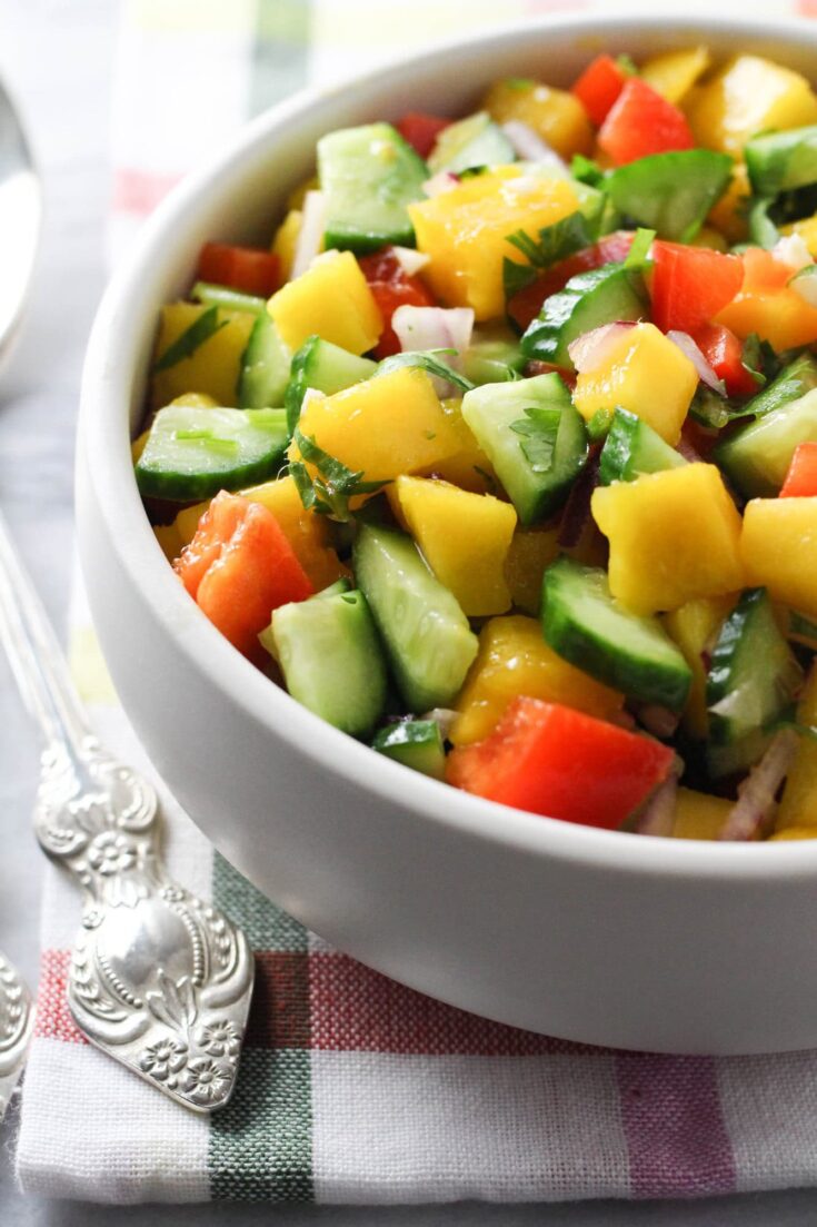 Mango cucumber salad in a bowl.