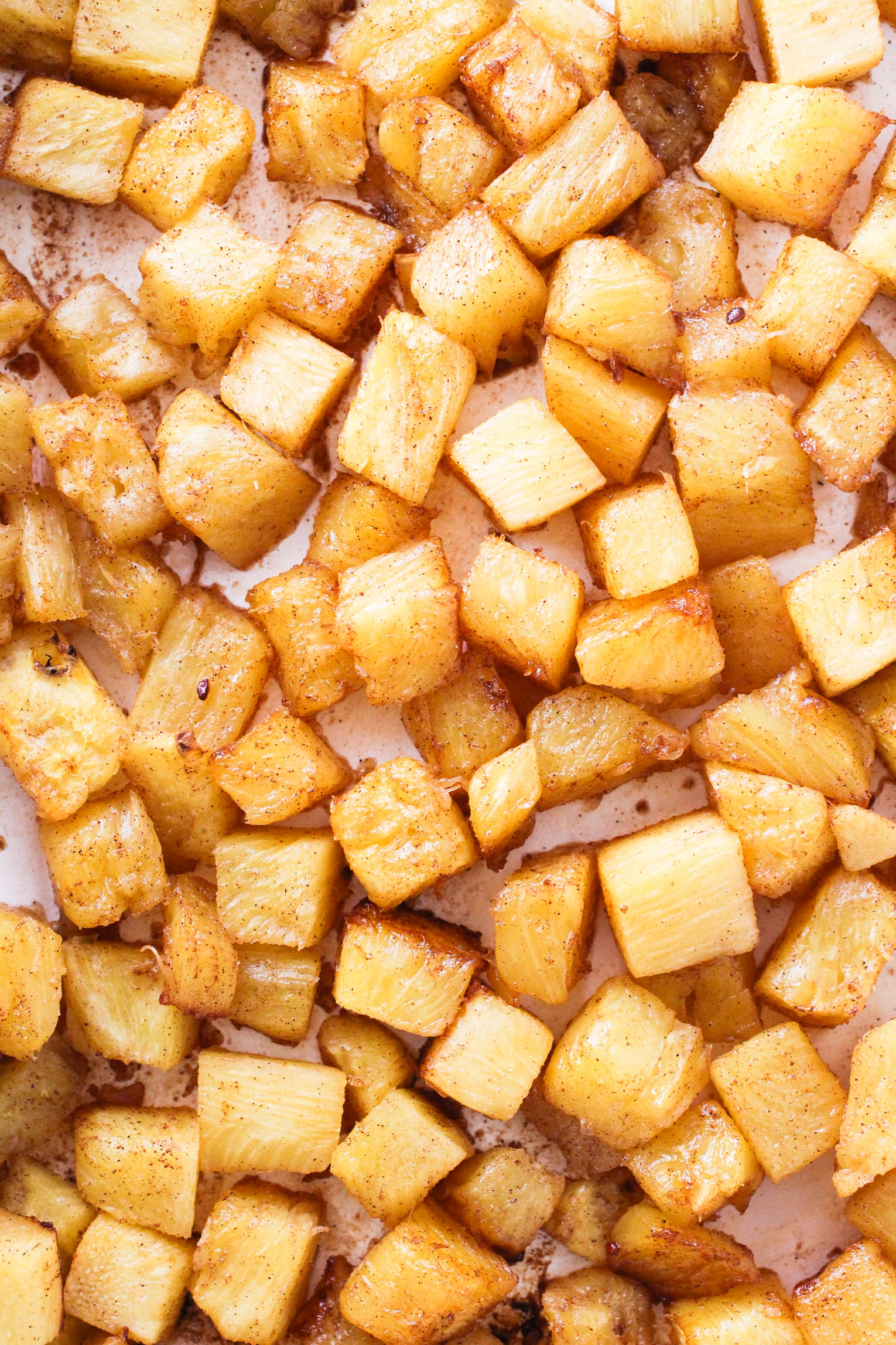 Close up shot of roasted pineapple pieces.