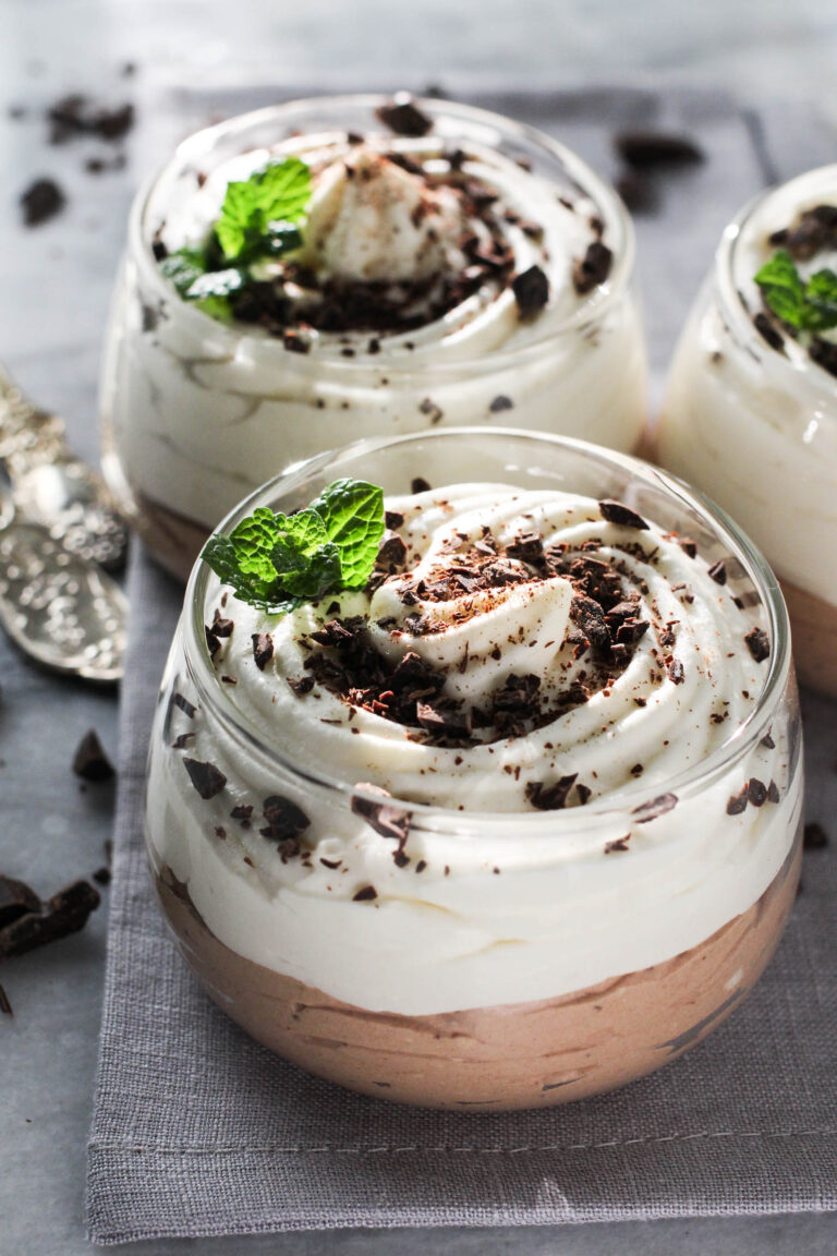 Vanilla Chocolate Cottage Cheese Mousse in dessert glasses garnished with chocolate shavings.