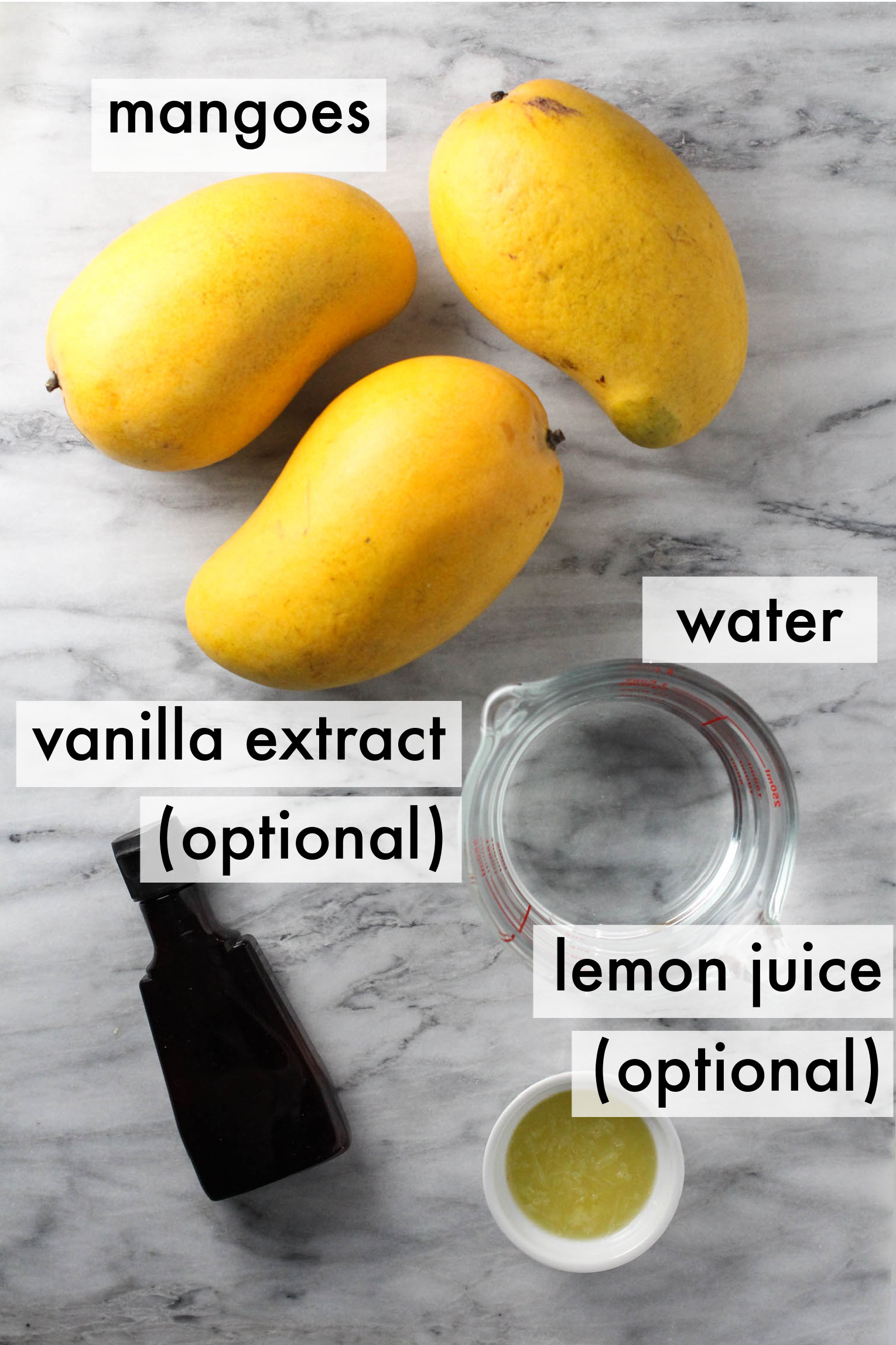 Mango juice ingredients displayed on marble background. The ingredients are labeled as follows: mangoes, water, vanilla extract (optional), lemon juice (optional).
