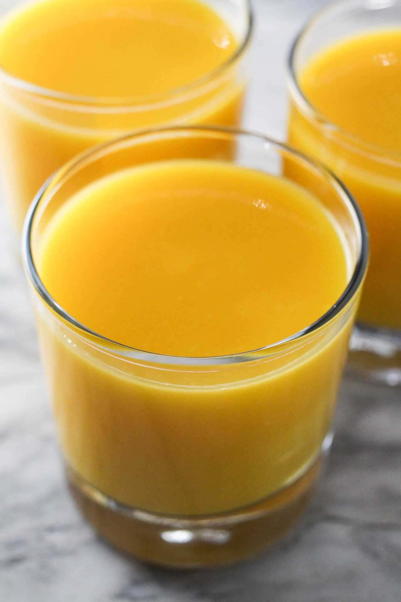 Mango juice in a glass.