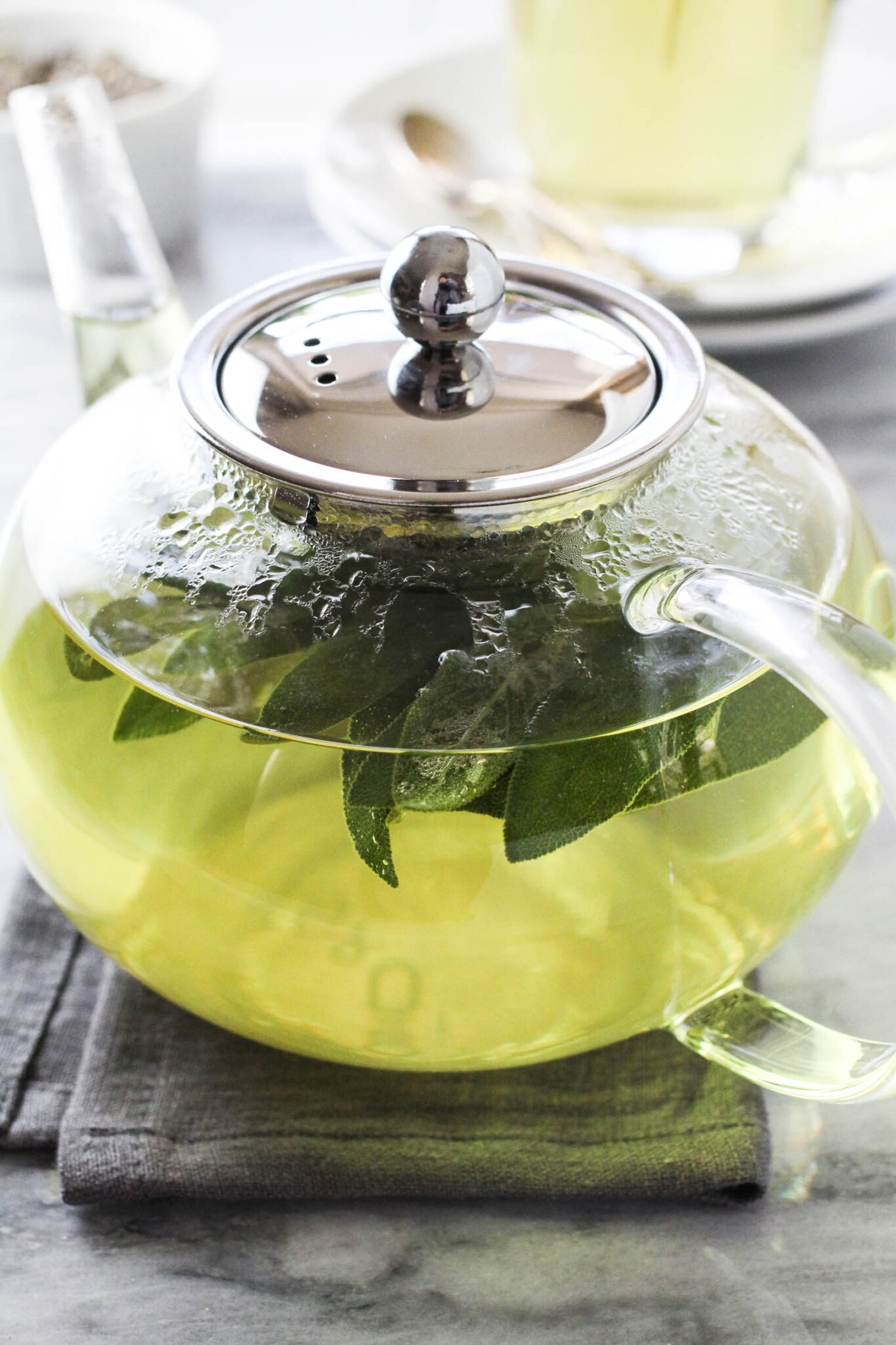 Sage tea in a tea pot.